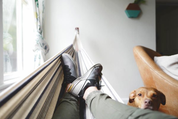 person laying on a hammock cooling your summer home