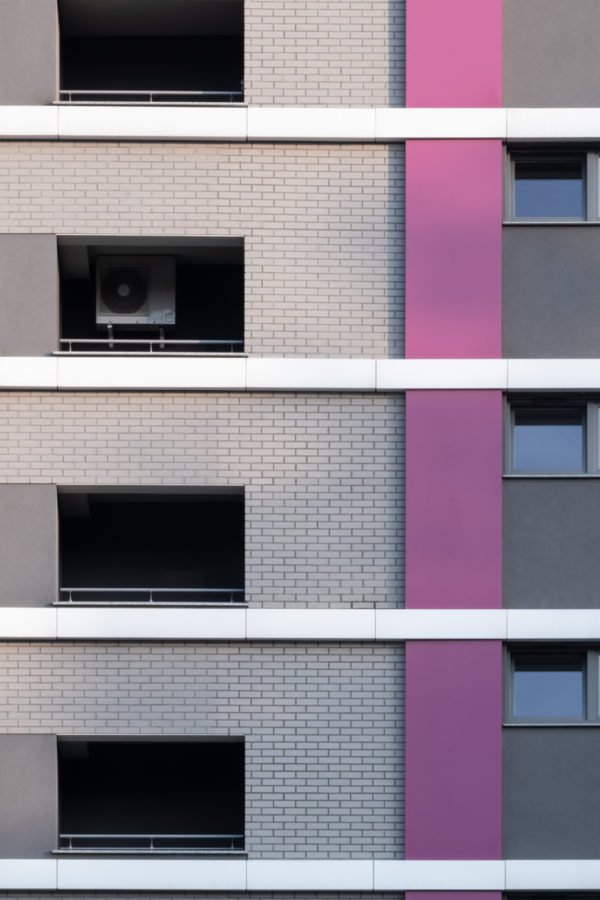 apartment building with an air conditioner at a window